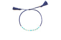 Geflochtenes Macramé-Armband in Dunkelblau mit blauen Apatit-Perlen und Quasten-Verschluss