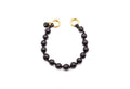 Kurzer Phone Strap aus geflochtenem Nylon mit schwarzen Holzperlen, Onyx-Anhänger und goldfarbenen Ringen